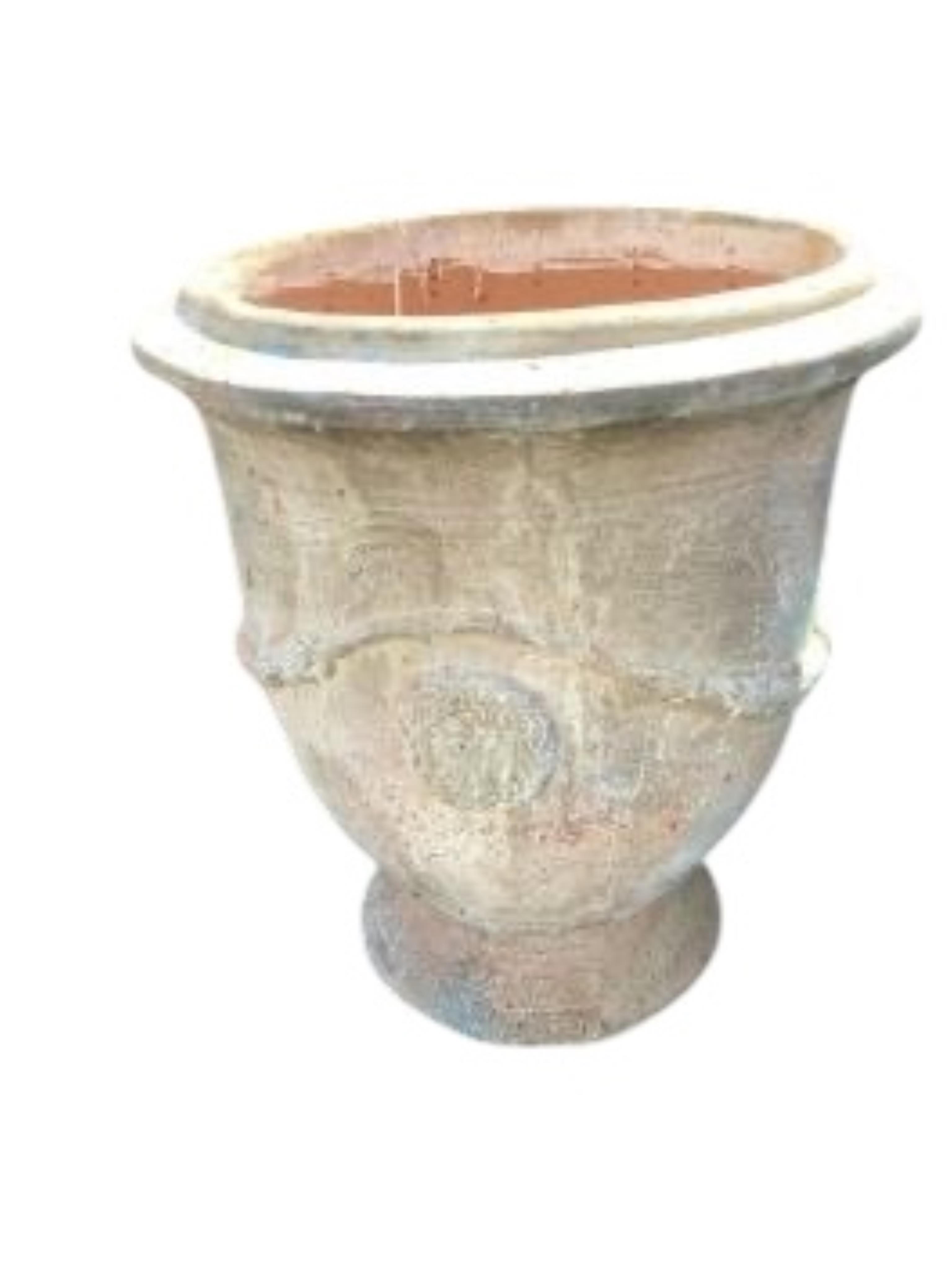 A pair of large circular earthenware garden planters, diameter 61cm, height 68cm